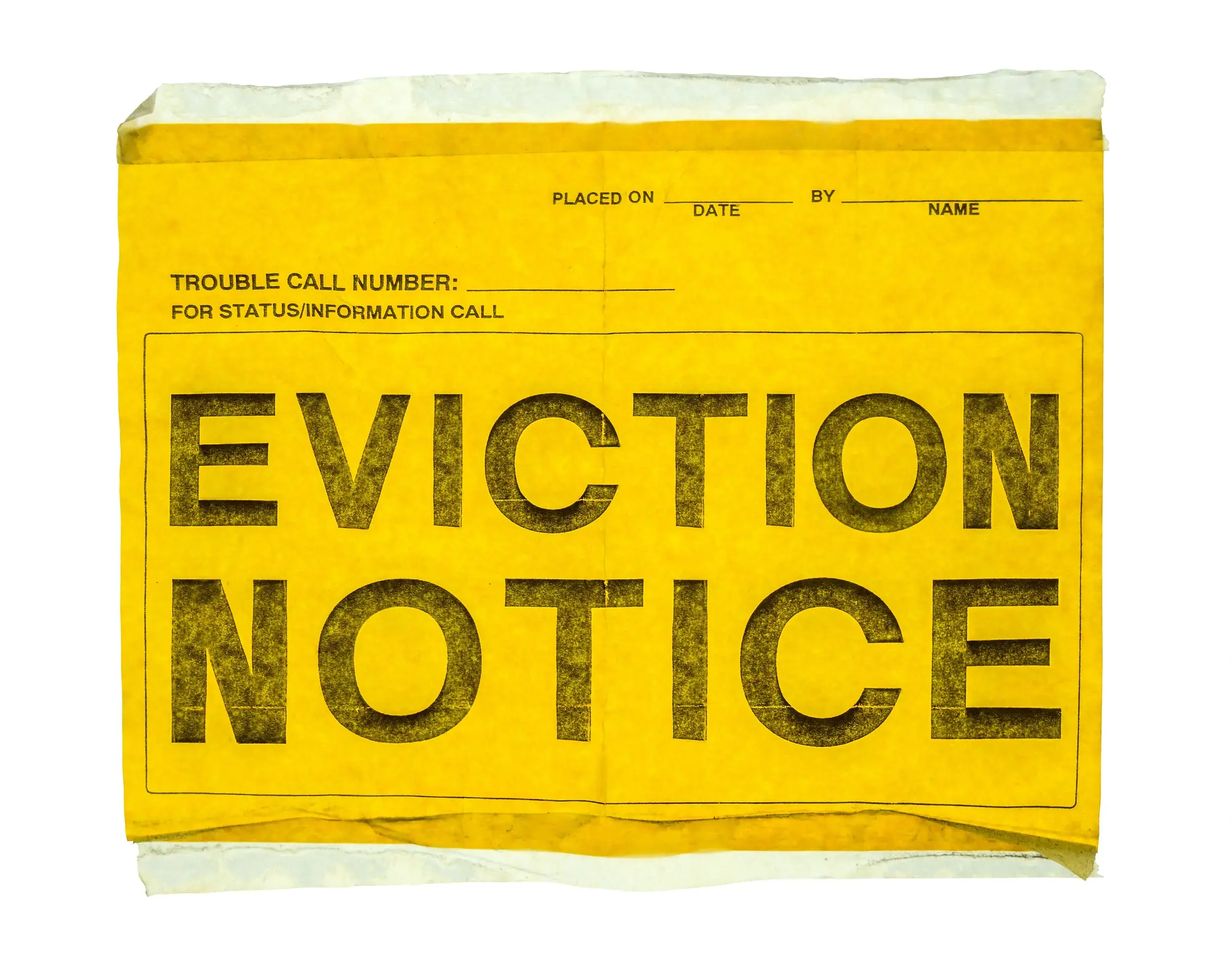 A yellow paper with bold black text reading EVICTION NOTICE. The notice includes spaces for date, name, and a trouble call number for status or information. The paper appears worn and slightly crumpled.
